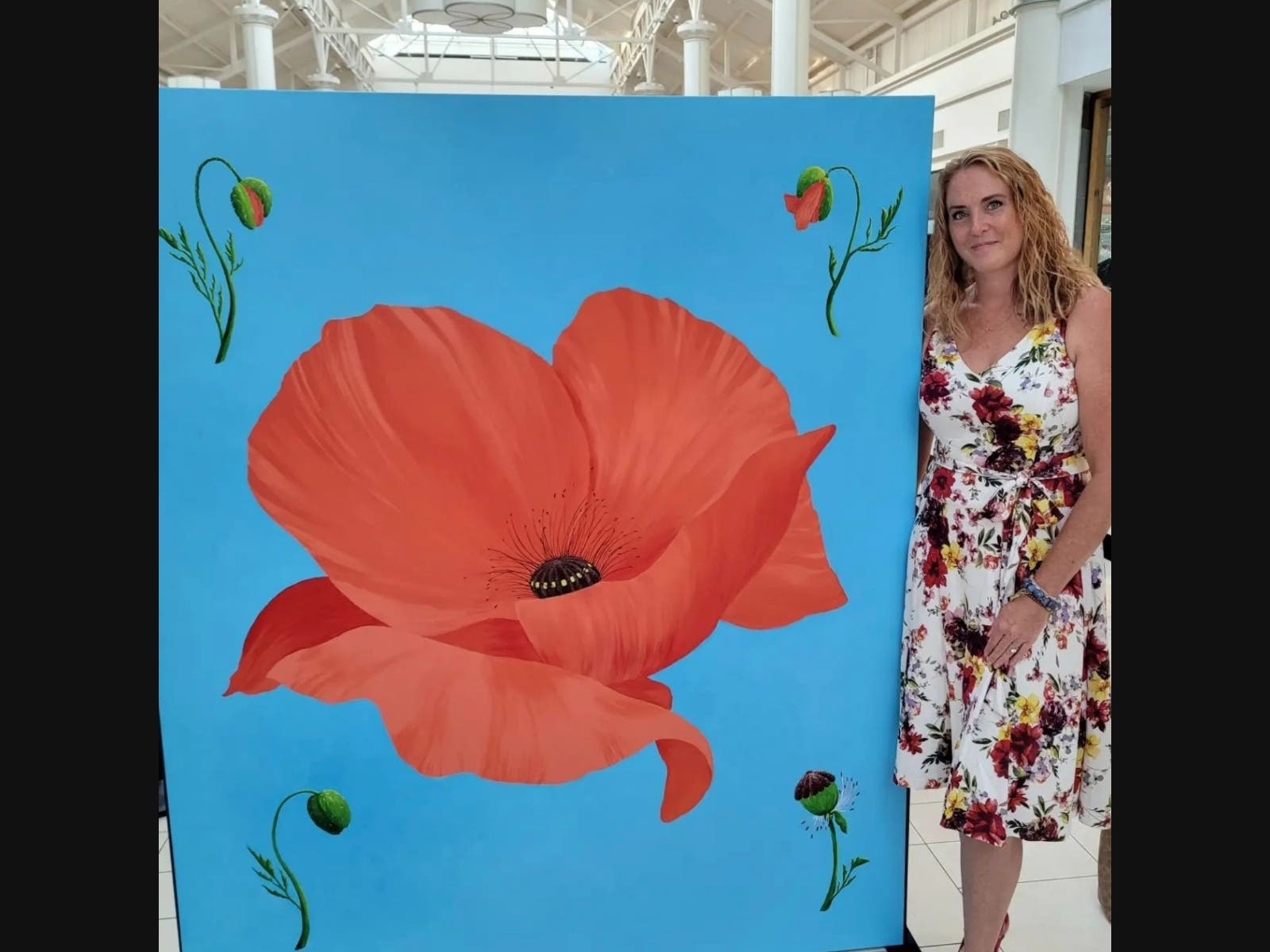Janelle Chandler reveals her Moving Mural panel at Danbury Fair mall. The panel is part of a special project to “inspire balance, hope and connection.”