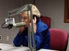 Barbara Davitt listens to a caller honoring her on the air