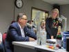 Waterbury Mayor Paul Pernerewski (at left) answers a question from Allison Demers