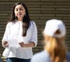 Caption 1: Quinnipiac student Amada Arroyo talks about the plants in the new Indigenous People’s Garden bed at the Albert Schweitzer Institute as part of Arbor Day festivities.