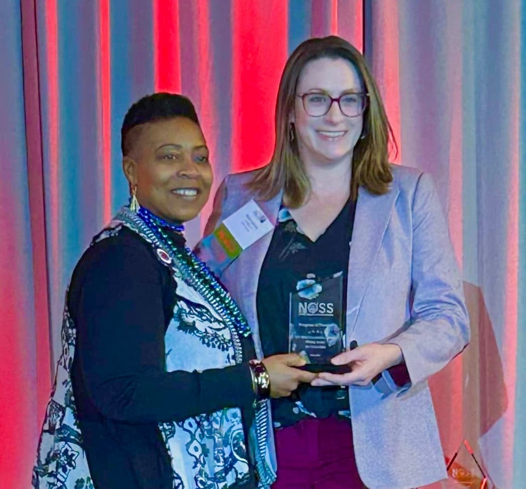 Rachel Jasiczek, Ph.D., CT State's Writing Across the Curriculum program coordinator (right), accepted the award from NOSS President Glynis Mullins on Saturday.