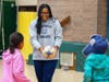 Caption 2: Quinnipiac Rugby player Kelsey Thomas discussed the importance of exercise and led children through safe rugby drills during Wellness Night activities at Hamden’s West Woods Elementary School.
