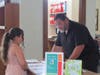 A young musician checks in with Charley Marenghi before the recital. 