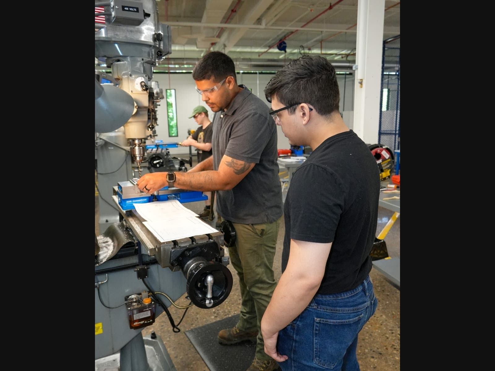 Manufacturing students work on a milling machine at the CT State Tunxis Advanced Manufacturing Technology Center in Farmington