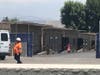 Temporary classrooms on the edge of a construction zone.