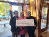 (L-R) TurningPoint Physical Therapist Janae Finley, Think Pink Chair & TurningPoint Board Member Marlene DeSimone, and TurningPoint Executive Director Tara Hall display the ceremonial giant check at the conclusion of this year's Think Pink charity event.