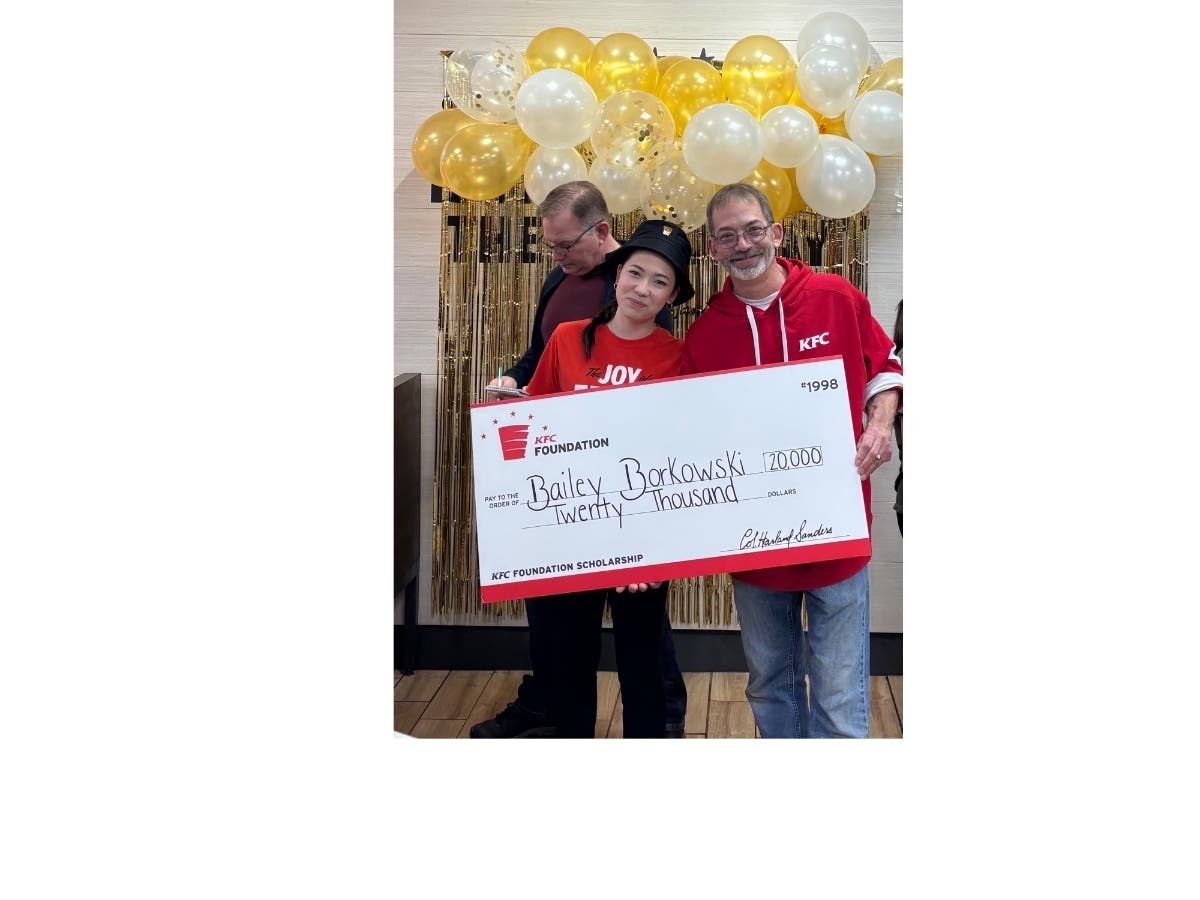 Bailey Borkowski (left) with her father Chris Borkowski, was awarded a $20,000 scholarship by the KFC Foundation.
