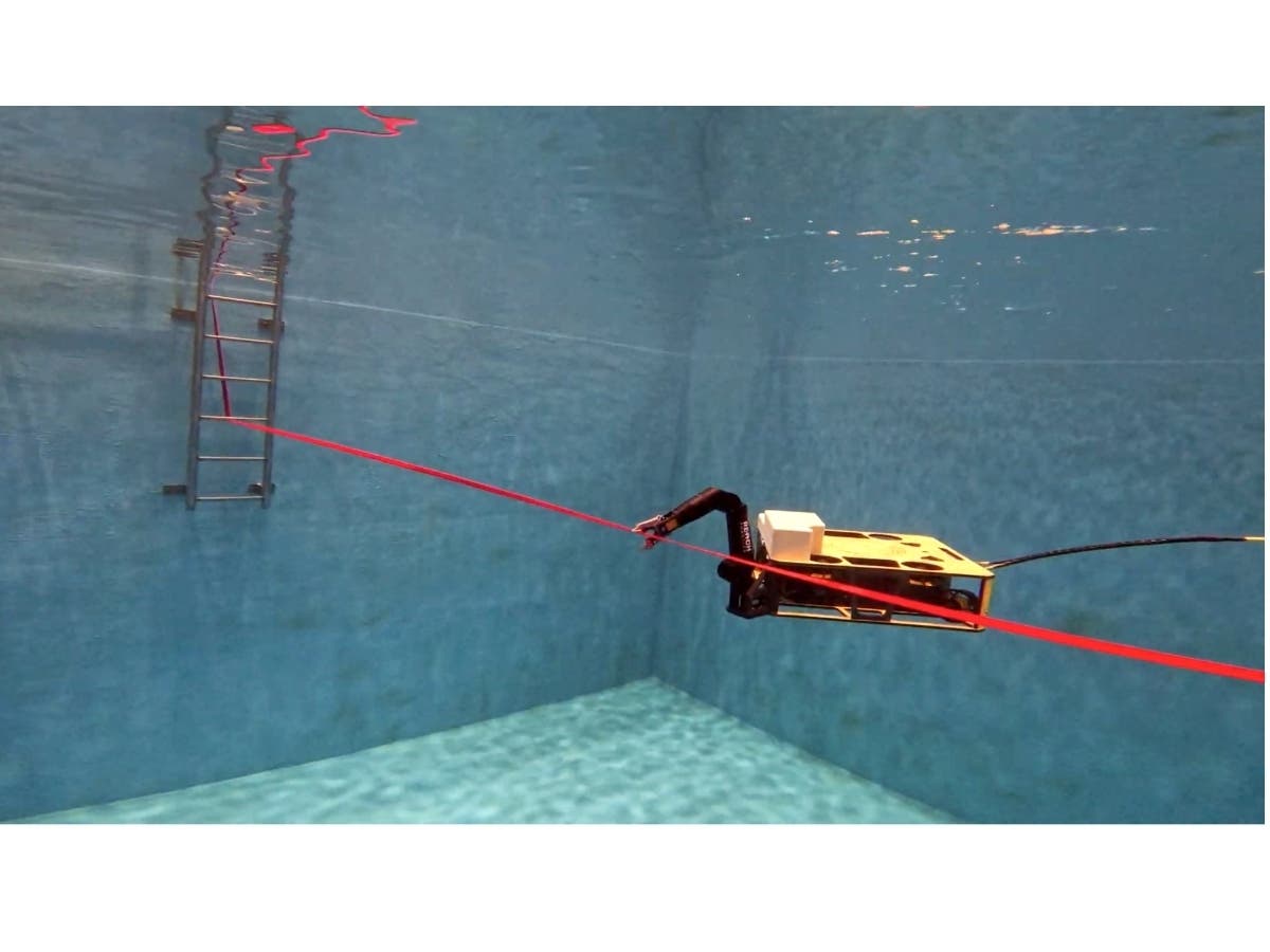 From within the ORL’s tank, ROV Rhody cuts the ribbon.