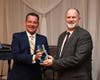 2018 Award Winner Jeff Reynolds of Nothing Bundt Cakes presents the award to 2019 Award Winner Jim Deiters, Director of the Oak Lawn Public Library