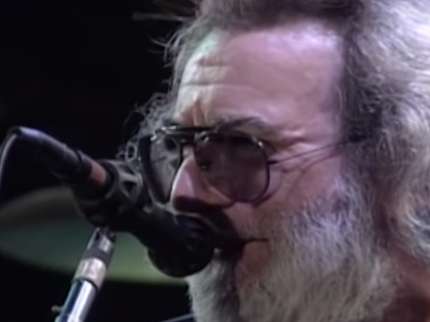Jerry Garcia performs "Eyes of the World" during the June 17, 1991 concert at Giants Stadium.