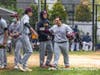 Joe Infante is congratulated after his first inning bomb