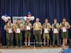 Mr. David Doucette with the NESA is flanked by the new Eagle Scouts.