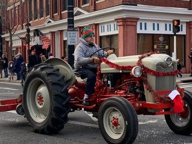 Tractors, shown here at Riverhead's annual Santa parade, will be the focus of a parade to honor healthcare workers at Peconic Bay Medical Center Tuesday.