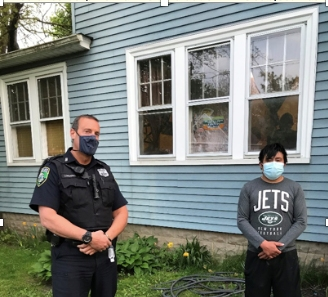 Riverhead police Officer Michael Lombardo (left) saved the life of a man (at right) who was choking Sunday, police said.
