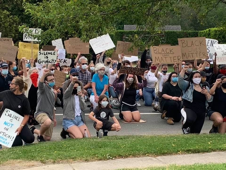 A crowd protested outside the police station in Southold last week after the killing of George Floyd.