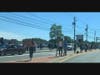 A crowd of protesters stood on both sides of Rt. 58 in Riverhead Saturday.