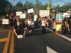 A crowd of protesters stopped traffic on Rt. 58 in Riverhead for almost nine minutes as they paid solemn tribute to George Floyd.