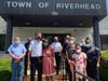 Doreen Williams brought pizza for the Riverhead Police Department, who escorted her home "like a queen" after a two-month hospital stay.