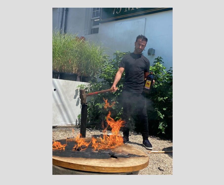 The table once frequented by Jeffrey Epstein and Harvey Weinstein was set on fire by the owner of 75 Main in Southampton.