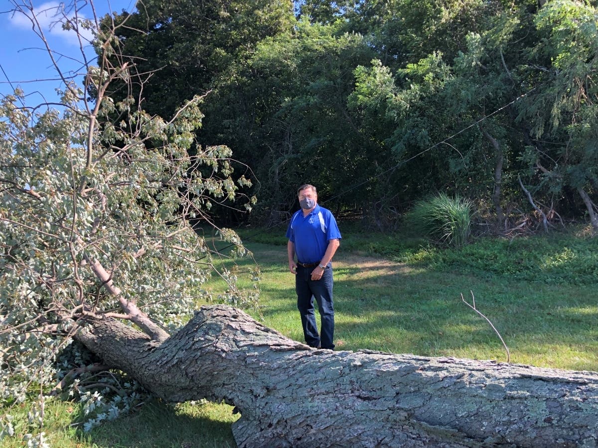 Brookhaven Town Supervisor Ed Romaine surveys storm damage.