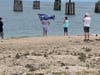 Supporters waved flags as the "TrumpStock" flotilla headed from the North Fork to the South Fork.