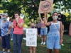 A group of about 60 gathered to speak out against Donald Trump in the Hamptons.