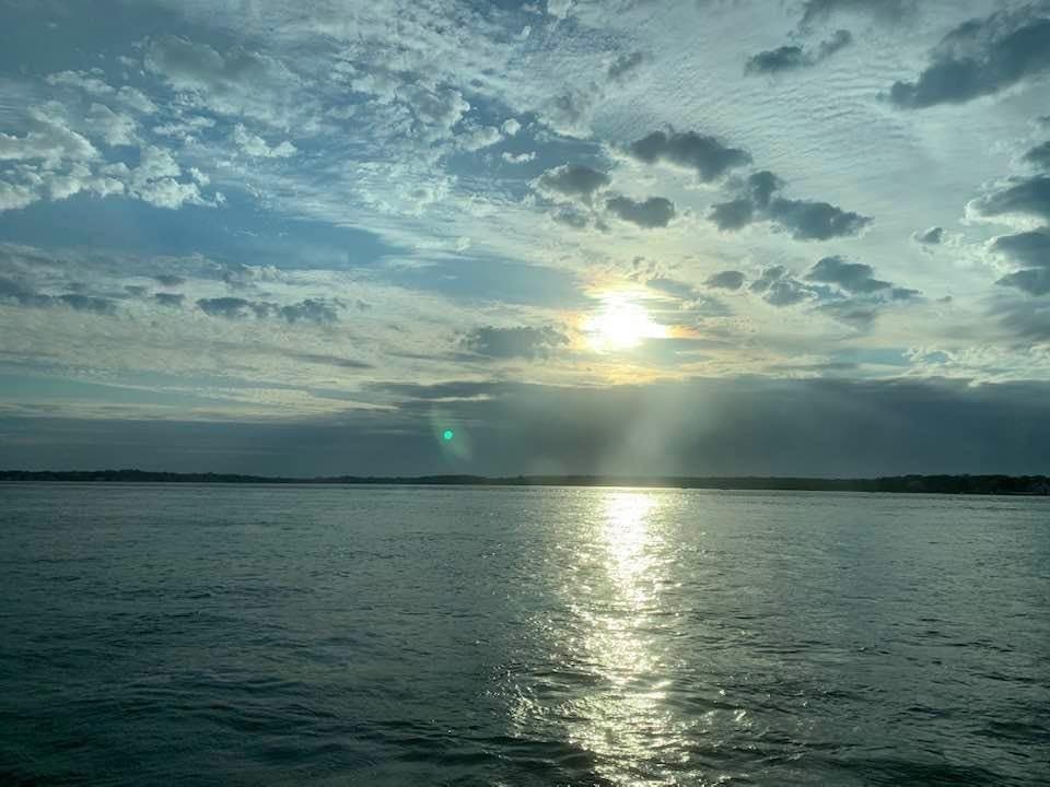 The kite surfer was rescued from the channel between Greenport and Sunset Beach on Shelter Island, police say.