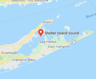 A Southampton bay constable and the Shelter Island harbormaster found the father clinging to a 15-foot vessel, police said.