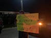 Carrying signs and waving flags, a group advocated for social justice Sunday.