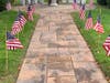 Flags blew in the wind as respects were paid.