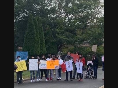Supporters of a young man hurt in a Hamptons "road rage" incident gathered outside the home of the man charged in the case.