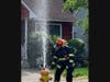 Firefighters battled a blaze that involved two homes and an RV in Greenport Friday, officials said.