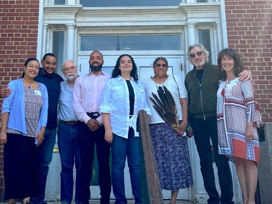 Roger Waters (second from right), who has advocated for the rights of the Shinnecock Nation in recent months, was onhand as the Southampton town board voted to preserve ancestral burial grounds in Shinnecock Hills.