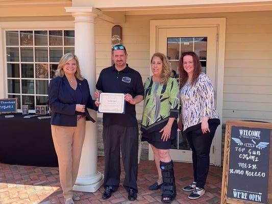 New York State Assemblywoman Jodi Giglio, Chris Kuehn, Riverhead Town Supervisor Yvette Aguiar and Jennifer Kuehn at the opening of Top Gun Cigars in Wading River.