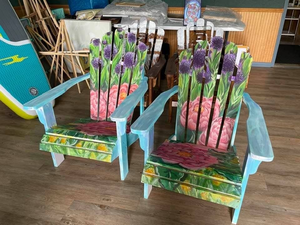 A pair of Adirondack chairs painted by local artists Alan Bull and Kara Hoblin are among the auction prizes.

