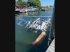 A boat sank after it exploded in a Greenport marina Tuesday.