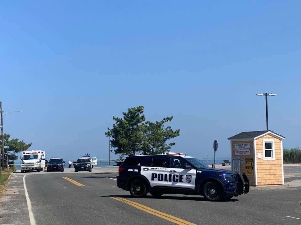 A woman was found dead in her car at Iron Pier Beach in Jamesport, police say.