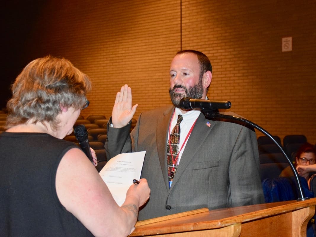 Dr. Augustine E. Tornatore taking his oath of office.