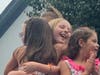Charlize Lucarelli was hugged by her friends after winning the title.