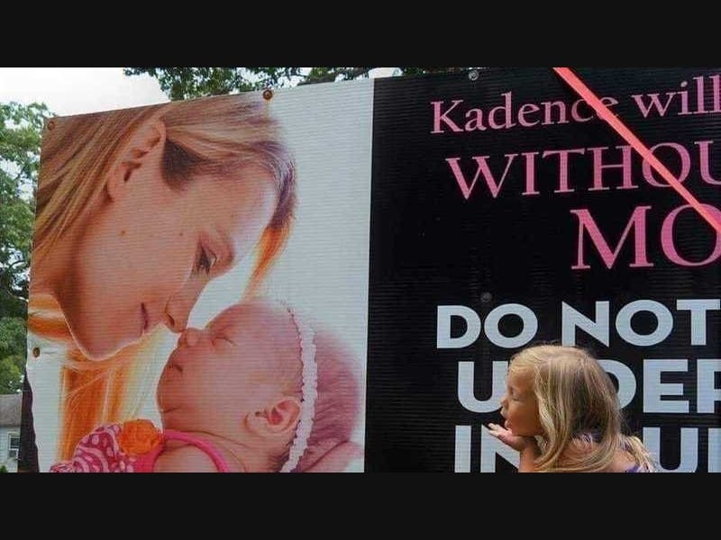 Kadence blows a kiss to the mother she will grow up without.