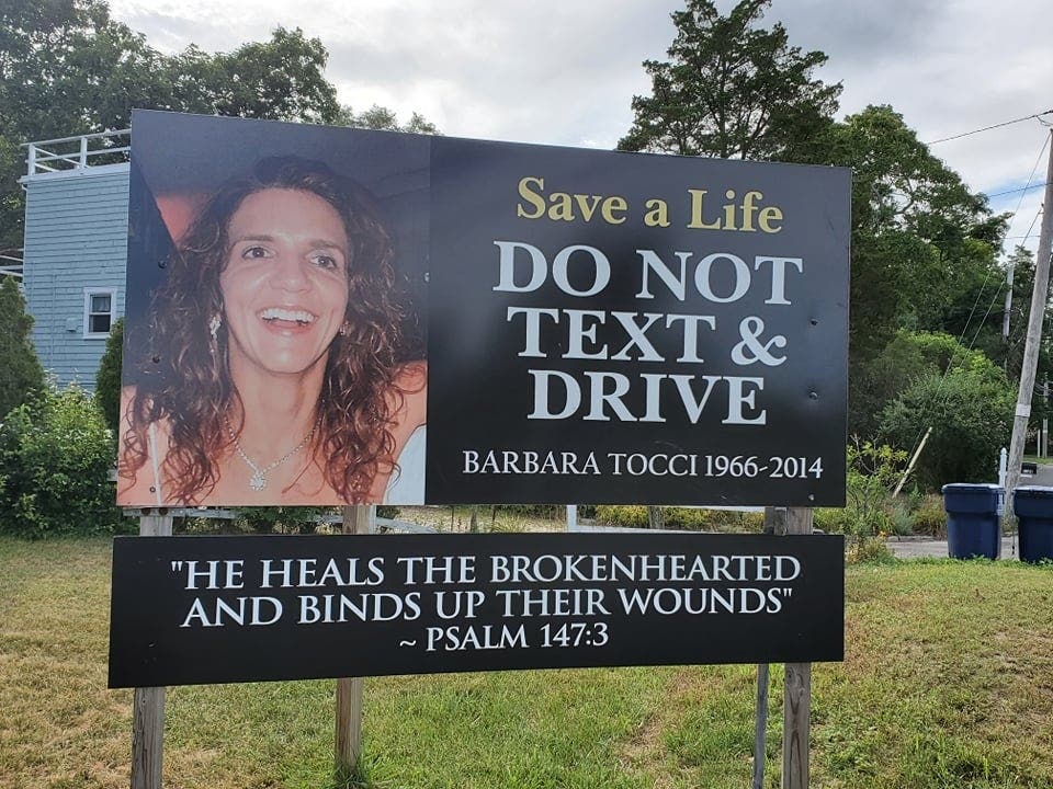 Signs erected after tragedy, urging motorists not to drive or text under the influence, can stay put — thank to an infusion of faith.