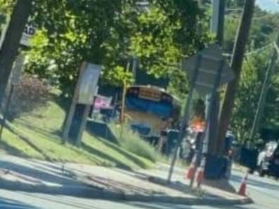 At least one person was airlifted and other injuries were reported after a school bus was hit in the rear by a truck on Flanders Road Monday, a first responder at the scene said.