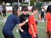 Students gathered pledges to run laps on the high school football field. 