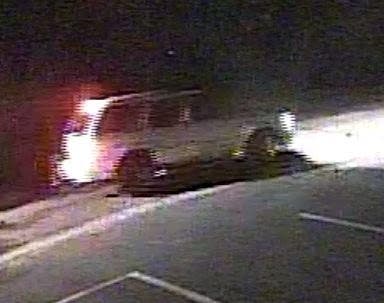 The driver of the vehicle detonated an incendiary device that shattered the back window of the vehicle, police said.