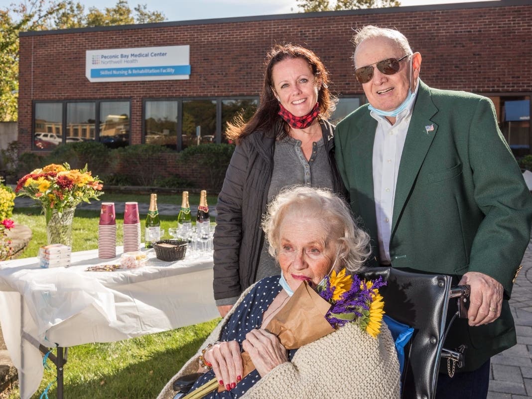 Peconic Bay Medical Center recently held a surprise 65th wedding anniversary ceremony for Skilled Nursing and Rehabilitation Center resident Patricia Connelly, 82, and her husband, Robert, 83, shown with their daughter Jackie Doskoez.