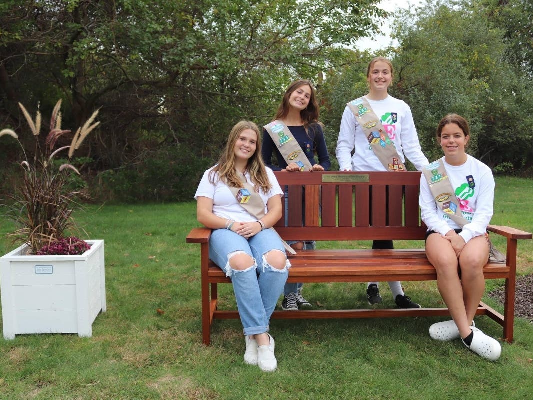 Girl Scouts Julia Cardi, Reagan Treharne, Ashleigh Doering and Jordyn Kollen from Troop #731 earned their Silver Awards when they presented a set of handcrafted mahogany benches and cedar planter boxes to the members of Peconic Landing.
