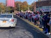 The kids cheered on the vets.