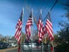 Old Glory flew proud against a blue sky on Veterans Day in Southold.
