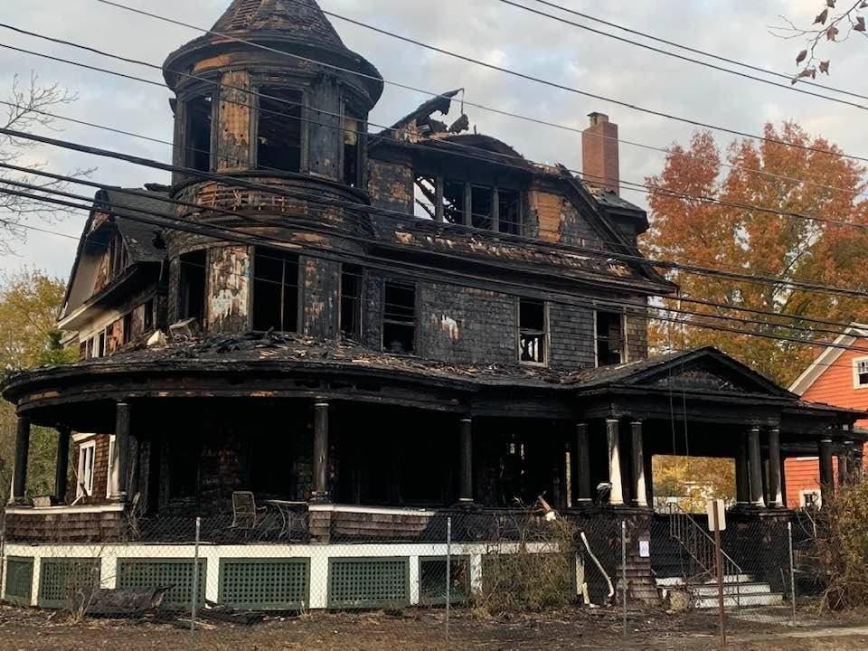 The gutted remains of a once-glorious, historic Riverhead home where five people died Tuesday night in a raging fire.
