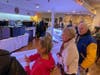 A long line of customers waited for their turn to order tempting fare from a special "I Stand With Ukraine" menu at Hellenic Snack Bar & Restaurant.